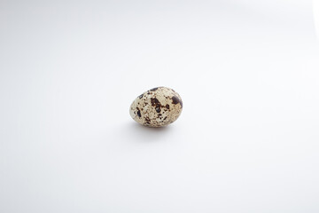 Quail eggs lie on a white background