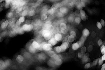 Unfocused and blurred reflections on  water of small river creek in Sauerland germany. Circular...