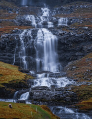 Europe, Faroe Islands. View of the village of Saksun and waterfalls on the island of Streymoy. November 2021