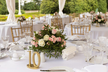 Wedding tables setting for dining outdoors. Wedding, decoration, celebration, floral design, holidays concept
