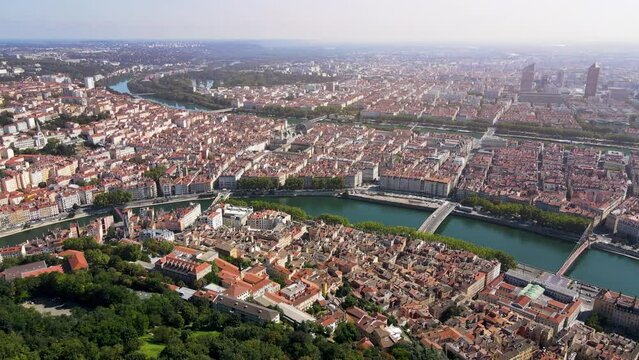 Lyon panorama from Fourviere hill, old town, presqu'ile peninsula, Part-Dieu city center, Rhone and Saone rivers, France. Aerial footage of famous touristic landmarks. Sunny warm summer day, blue sky