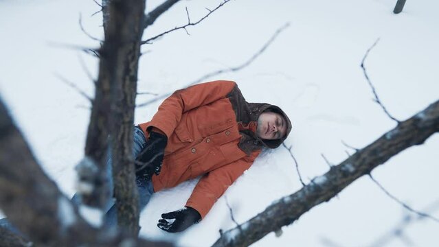 Frozen man on the ground in winter