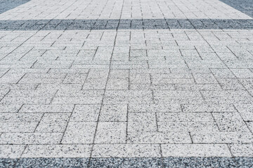 Close up, texture, background. Rectangular paving slabs from a granite crumb.