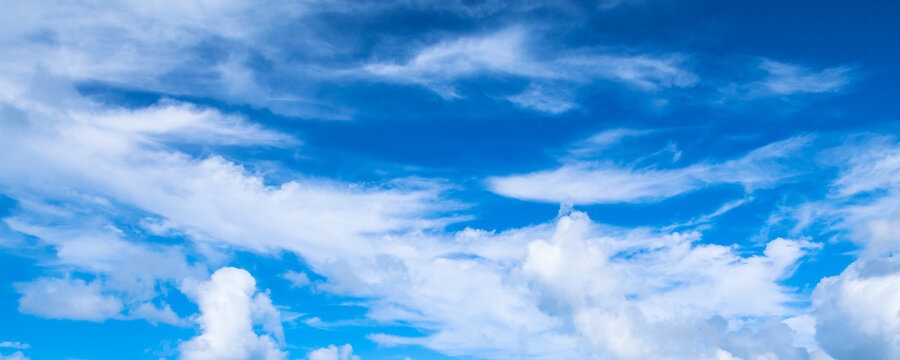 Deep blue sky with different types of clouds. Panoramic photo