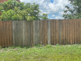 wooden fence and green grass