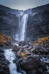 Fossa Waterfall on island Bordoy. This is the highest waterfall in the Faroe Islands, situated in wild scandinavian scenery. November 2021