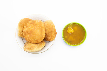 poori or puri with spicy Chole Bhature isolated on white baackground