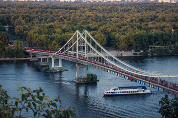 Obraz premium Pedestrian Bridge leading to the Trukhaniv Island in Kyiv, Ukraine