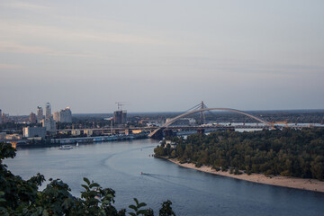 View of the embankment, bridges and Dnipro river from New Pedestrian and Bicycle Bridge in Kyiv, Ukraine in summer