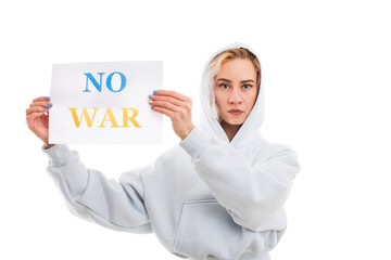 A young woman holds a no war poster on a white background