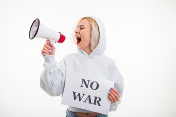 A young woman shouts into a megaphone and holds a no war poster on a white background
