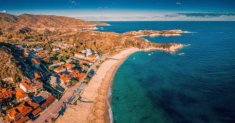 Foto op Canvas Visit Kalamitsi beach in Greece. Aerial view of the idyllic seascape on the Sithonia peninsula in Halkidiki. High above the roofs of the resort village with villas and hotels. © EdNurg
