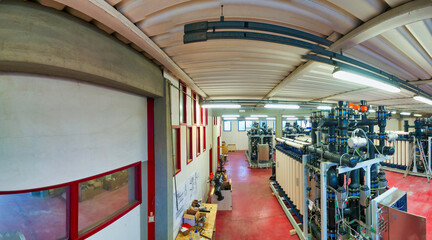 Fototapeta premium Panoramic view of pipelines in a water purification plant, industrial concept.