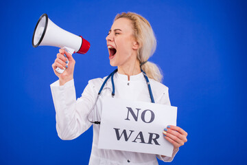 A female doctor shouts into a megaphone and holds a poster saying no to war