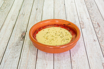 provoleta is a wheel of provolone cheese that is a tradition in Argentina to serve it roasted or...