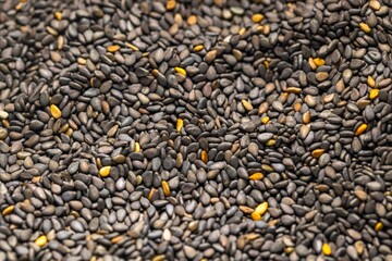 Closeup photo of natural dried black seeds rotating
