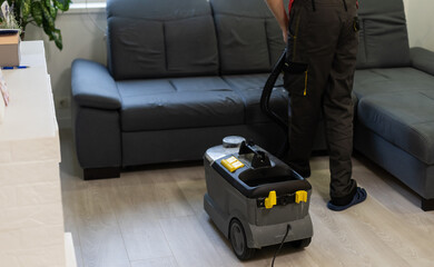 Removing dirt from sofa with upholstery cleaner, closeup