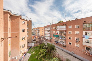 Facades of residential apartment buildings with a garden between them