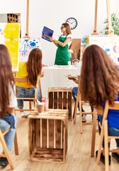 Group of young artist girls having draw lesson at art studio.