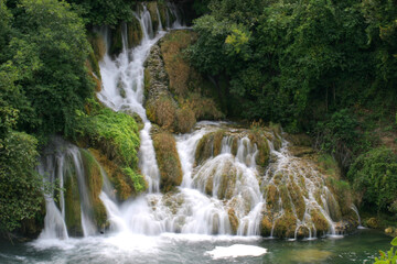 Fototapeta na wymiar Beautiful waterfall with green vegetation in Croatia 