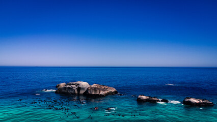 blue ocean with island rocks setting the scene