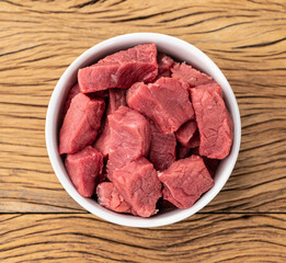 Chopped topside meat in a bowl over wooden table