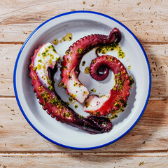 cooked octopus with garlic and parsley