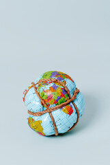 earth globe tied with rope