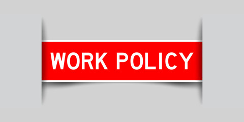 Inserted red color label sticker with word wokr policy on gray background