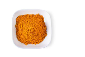 Top view of Turmeric Powder in bowl isolated on white background