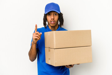 Young African American delivery man isolated on white background having an idea, inspiration concept.