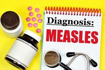 Measles is an infectious viral disease. The inscription of the diagnosis in the medical folder on...