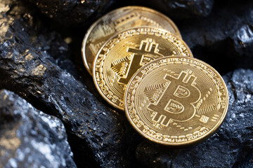 Gold coin bitcon and coal.