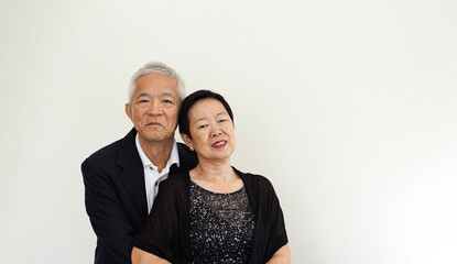 Asian senior elderly couple happy business owner hugging each other smiling