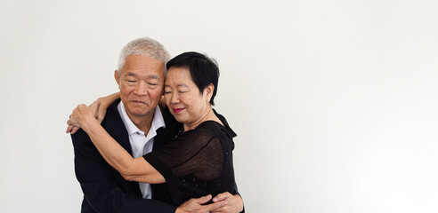 Asian senior elderly couple happy business owner hugging each other smiling