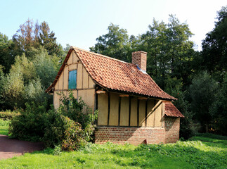 Fototapeta na wymiar lovely ancient yellow farmhouse, Bokrijk, Belgium