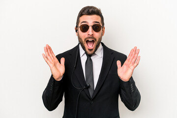 Young caucasian bodyguard man isolated on white background surprised and shocked.