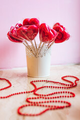 red lollipop rose in a basket