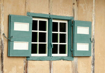 Obraz na płótnie Canvas window of a lovely ancient yellow farmhouse, Bokrijk, Belgium