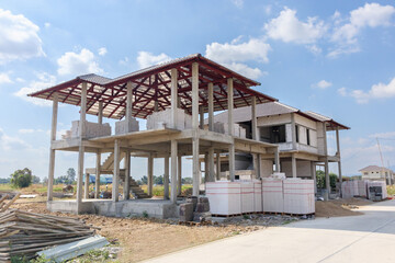 Fototapeta na wymiar construction residential new house in progress at building site housing estate development