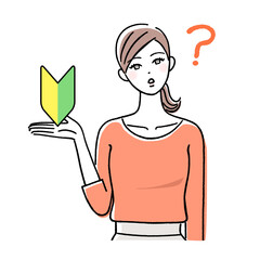 初心者マークを持って考える若い女性