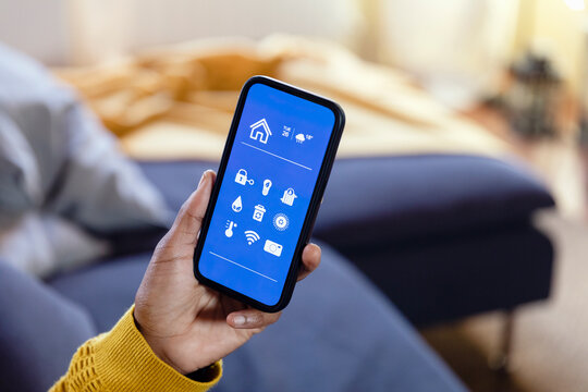 Woman using mobile app in living room