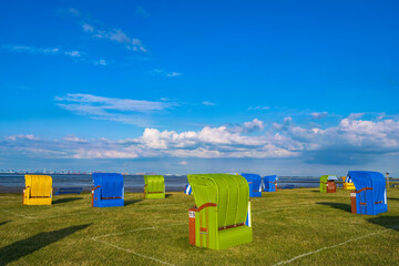 Colorful beach chairs on the beach in Burhave/Germany on the North Sea 
