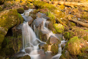 Long exposure of flowing water of a small waterfall in Westerwald/Germany 