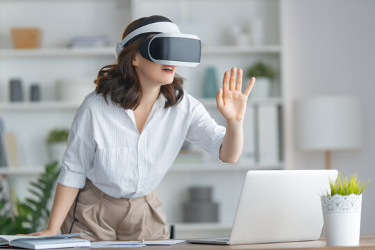 Woman with VR virtual reality goggles