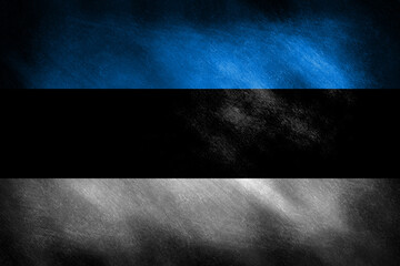 The Estonian flag on an old looking background