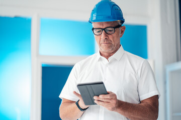 Construction worker using tablet computer