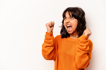 Young hispanic woman isolated on white background raising fist after a victory, winner concept.