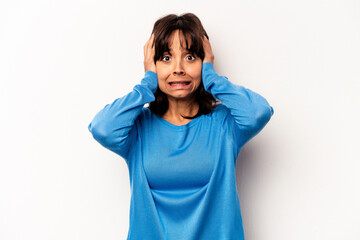 Young hispanic woman isolated on white background being shocked, she has remembered important meeting.