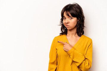 Young hispanic woman isolated on white background smiling and pointing aside, showing something at blank space.